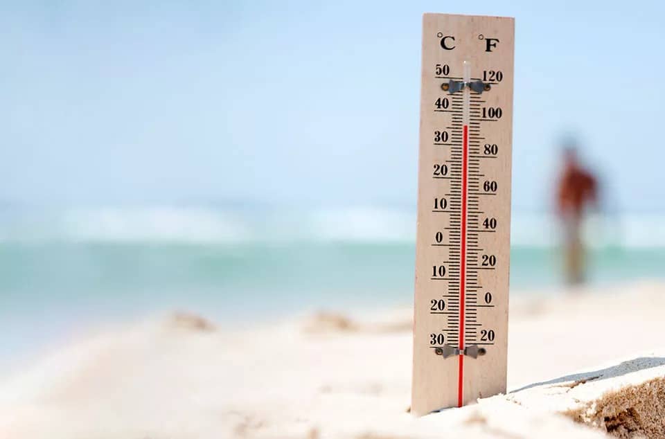 thermometer in the sand in summer