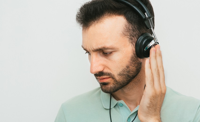 man listening in headphones